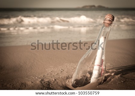 A message inside a glass bottle, washed up on a remote beach.