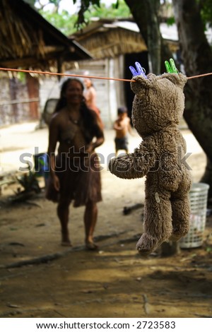 This teddy bear was hanging, drying in the middle of an indian tribe in the Amazon.