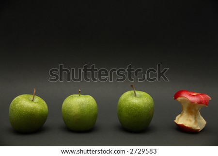 A line of apples with one exception.