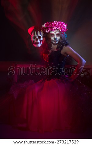 halloween make up sugar skull beautiful model with perfect hairstyle. Santa Muerte concept.