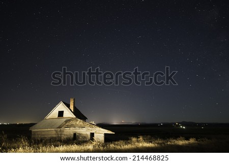 Old Ranch House in Belle Fourche, South Dakota with Night Sky Filled with Stars.