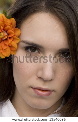 Pretty Woman with Flower in Hair