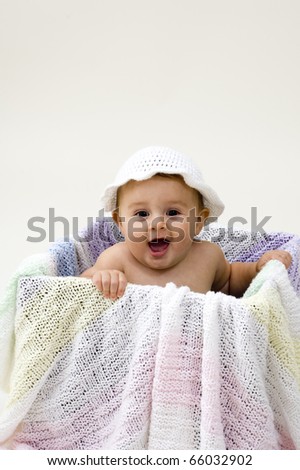 Cute Baby in a Box with Crochet Hat.