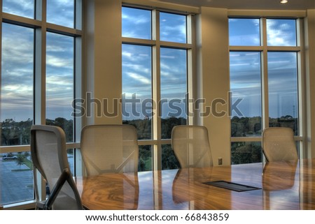 HDR of Office Conference Room with Windows at Sunset.