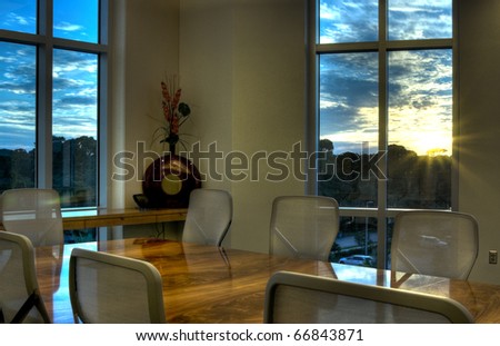HDR of Office Conference Room with Windows at Sunset.