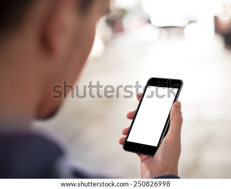 Man using mobile smartphone. Shot with third-person view, blank screen. Similar to iPhone