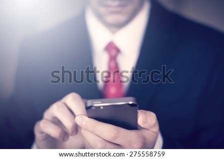 Businessman working on the smartphone