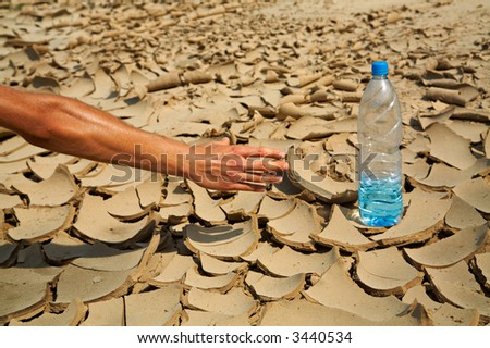The human hand tries to keep step with a bottle with water