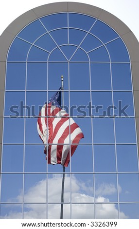 A reflection of an American flag in the windows