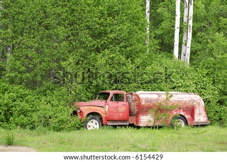Abandoned old truck by the forest