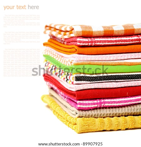 Pile of linen kitchen towels on a white background (with sample text)