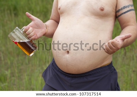Fat man with a beer in hand