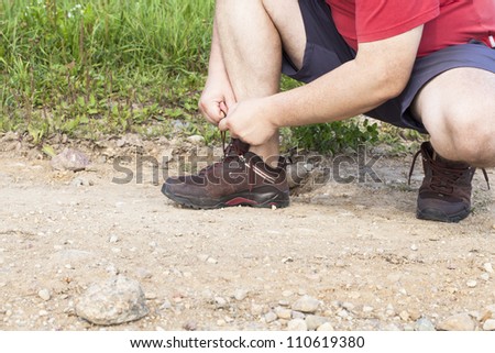 Man tied shoe laces on the trail