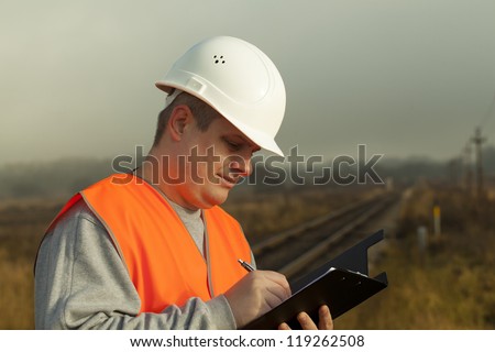 Railroad employee with a folder