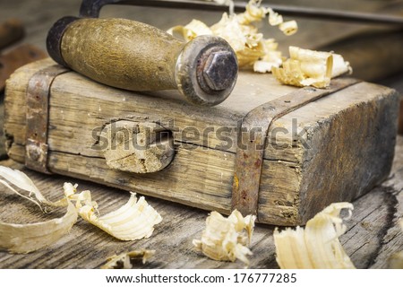 Old carpenter\'s hammer on wooden table