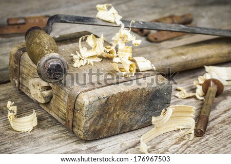 Old carpenter\'s hammer on a old table