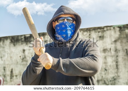 Man with a baseball bat at outdoor