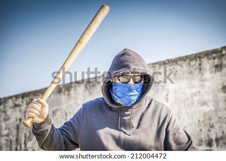 Aggressive man with a baseball bat
