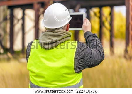 Engineer with tablet PC at outdoors