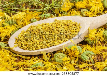 Bee pollen grains with dry calendula around