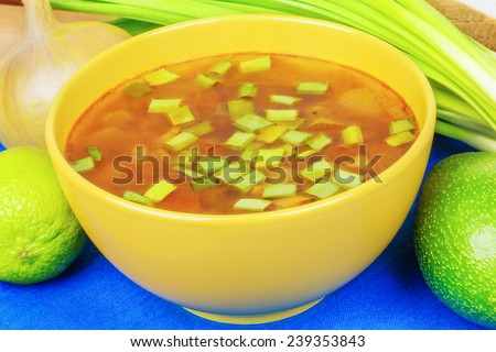Bowl of onion soup with spring onion