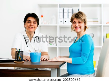 Pregnant woman in the doctor's office. She has a prenatal check up.