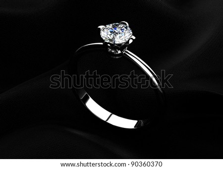 stock photo The beauty wedding ring on black background