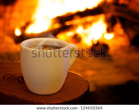 Hot smoking coffee by fireplace