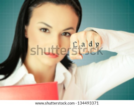 Young businesswoman image with focus on her hand showing tattoo