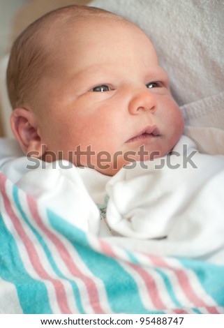 Newborn Baby Pictures  Hospital on Newborn Baby Boy Warped In Hospital Blanket Stares Off In The Distance