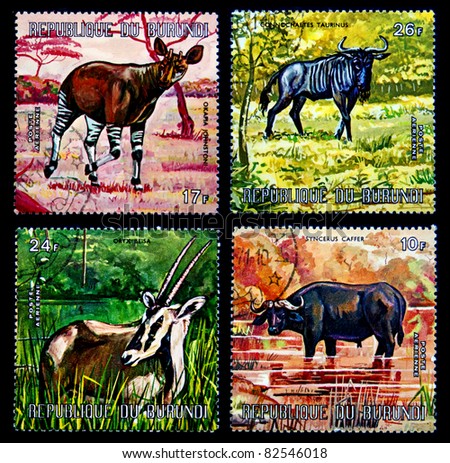 REPUBLIC OF BURUNDI - CIRCA 1977: A stamp printed in Republic of Burundi shows African animals, Okapi, Blue Gnu, East African Oryx and African buffalo, series, circa 1977