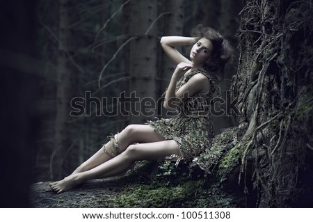 Eco girl lying on the trunk