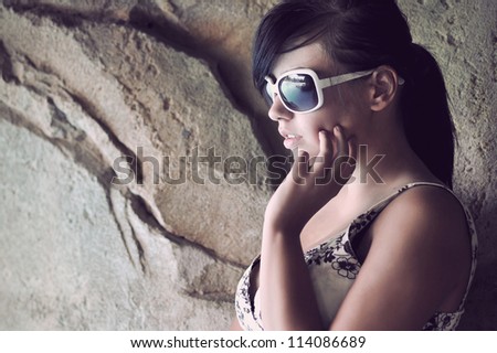 Perfect fashionable lady wearing sunglasses