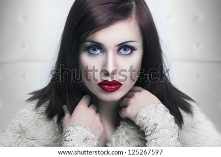 Cold portrait of a young lady with red lips