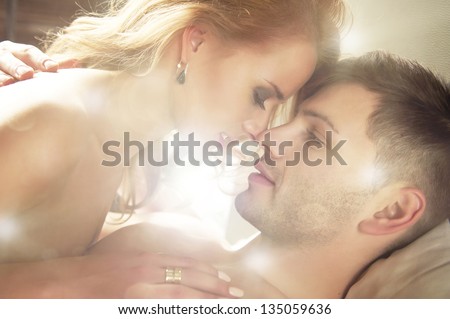 Sexy Young Couple Kissing And Playing In Bed.