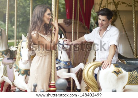 Young joyful couple visiting an attractions park