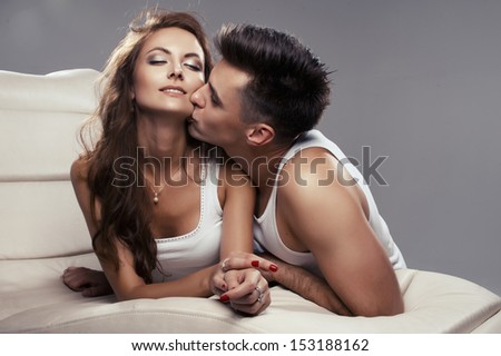 Handsome man and sexy woman in bed