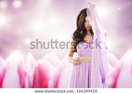 Beauty woman in violet dress.