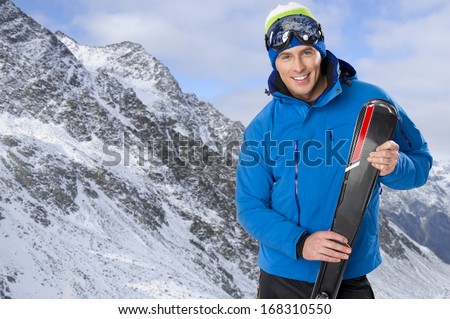 Beauty Smiling Man In Winter In Mountains