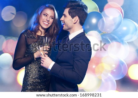 Smiling couple with glasses of champagne
