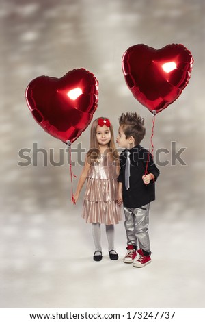 Happy Kids With Red Heart Balloon On A Light Background