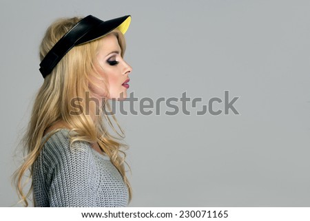 Attractive long haired beautiful woman with cap