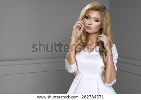 Blond beauty wearing white dress