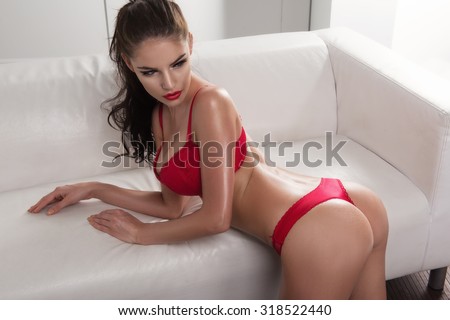 Sensual woman with perfect slim body posing in lingerie