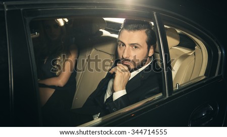 Sexy couple in the car. Focus on man