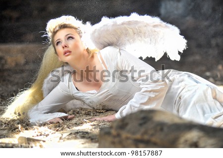 Beautiful angel woman lies in theatre