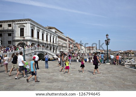 VENICE - AUGUST 14: Tourists in San Marco coast on August 14, 2012  in Venice, Italy.  San Marco coast is the most important international landmark of Venice.