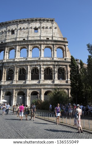 ROME - AUGUST 18: Tourist visit Coliseum, one of the most popular tourist attraction on August 18, 2012 in Rome.