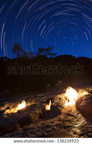 The fires of Yanartas (flaming rock) at night, Antalya, Turkey. small Fires which burn constantly from vents in the rocks on the side of the mountain.