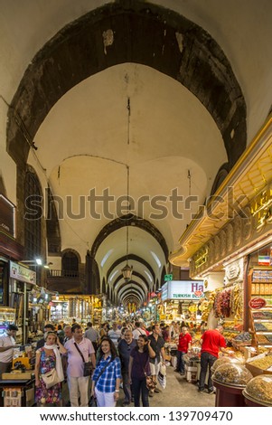 ISTANBUL, TURKEY- MAY 24: People and tourists visit and shopping in Spice bazaar on May 24, 2013. Spice Bazaar is in Fatih district of Istanbul, Turkey. It is asian style market and atracts visiters.